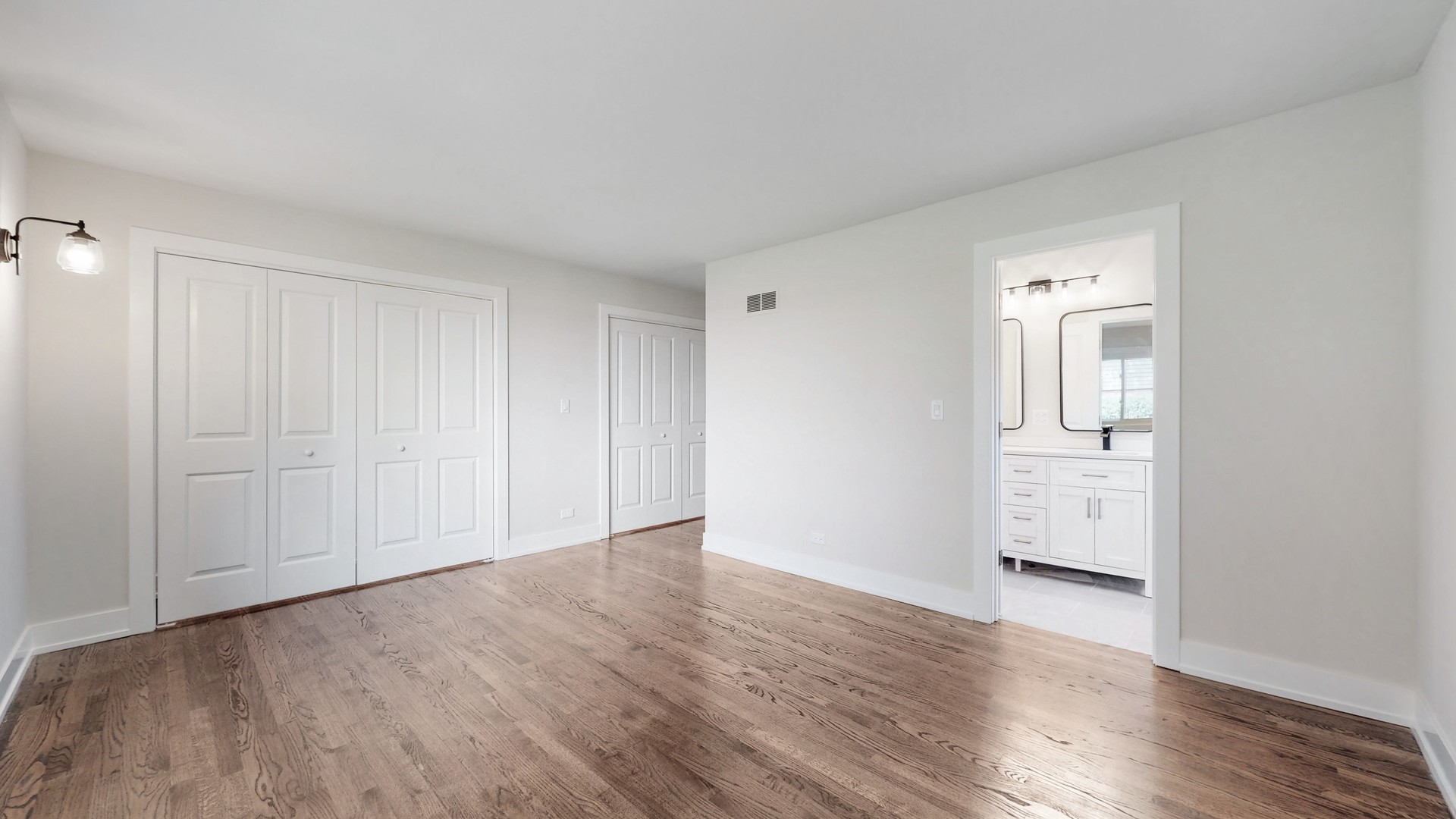 1617 Birch Road Northbrook, IL 60062 - Photo 16 of 32 a view of an empty room with wooden floor and a window