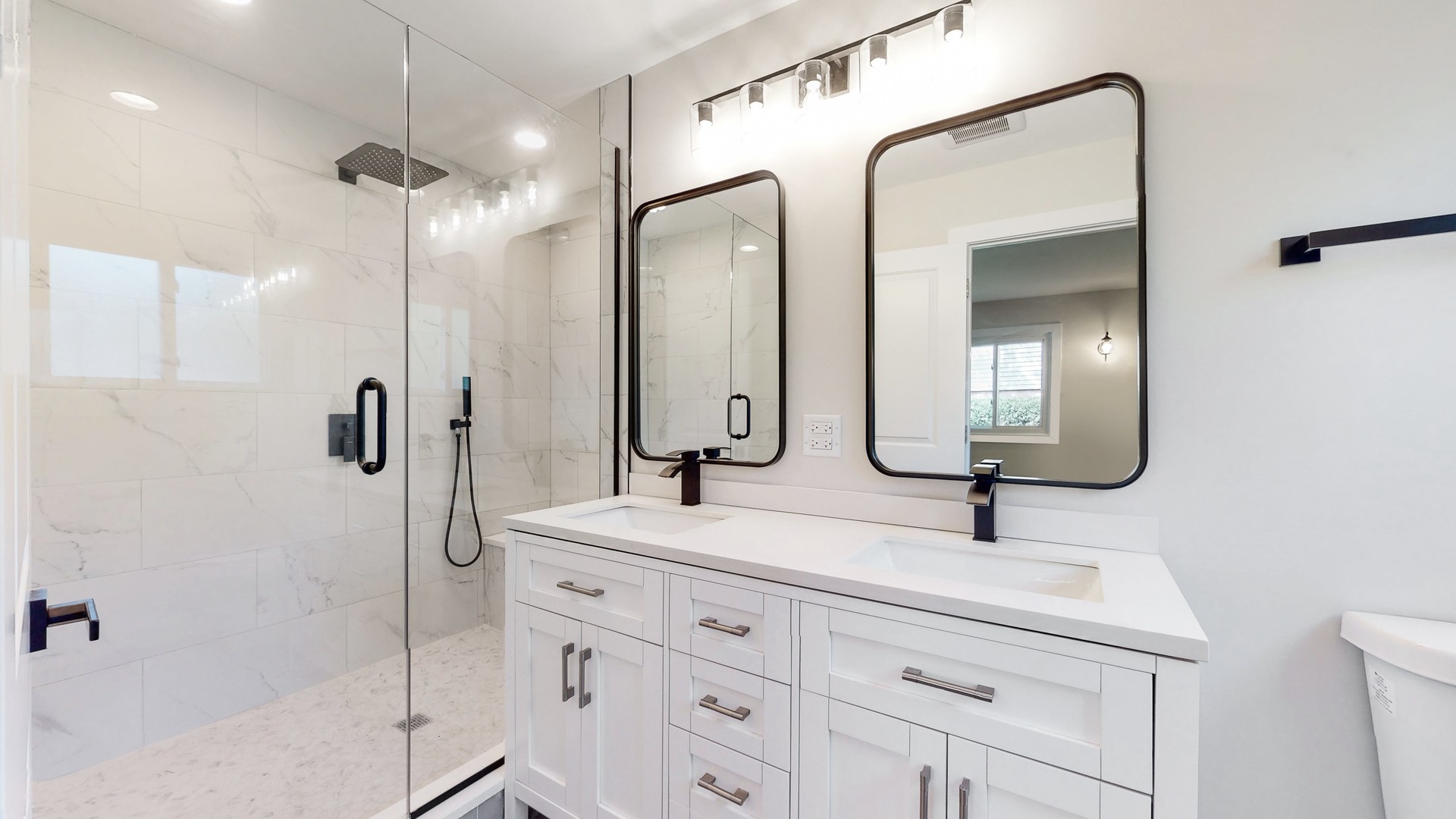 1617 Birch Road Northbrook, IL 60062 - Photo 18 of 32 a bathroom with a double vanity sink mirror and shower