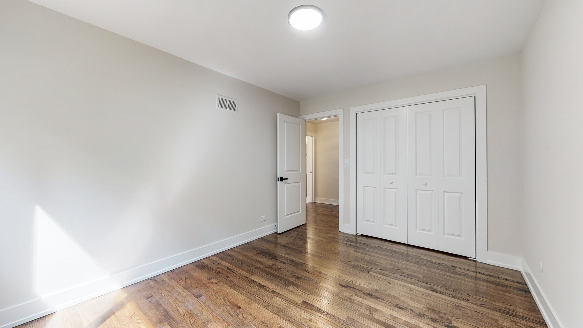 1617 Birch Road Northbrook, IL 60062 - Photo 20 of 32 a view of an empty room and wooden floor