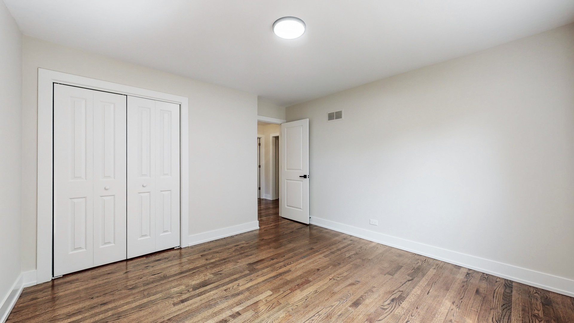 1617 Birch Road Northbrook, IL 60062 - Photo 21 of 32 a view of an empty room with wooden floor