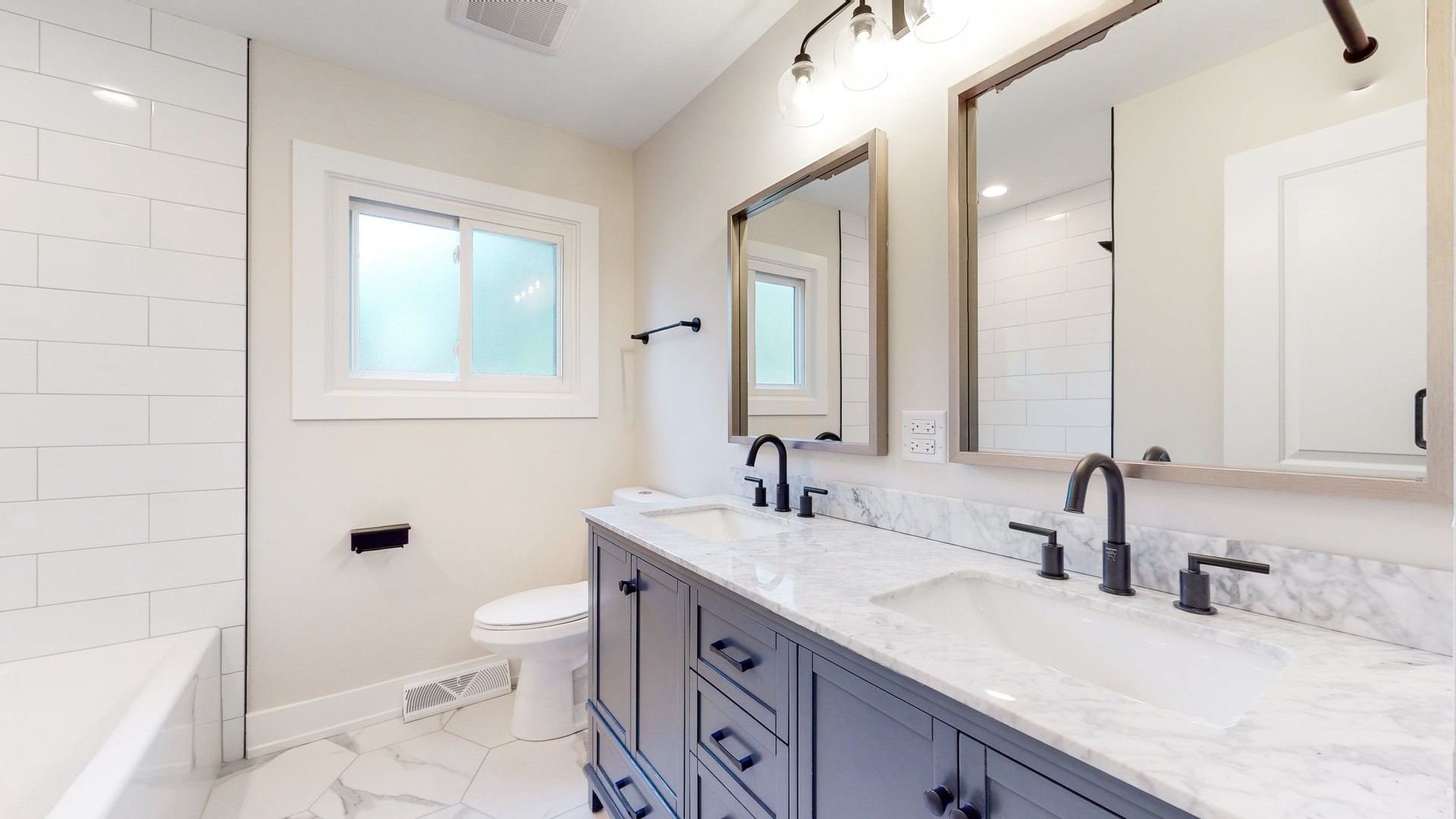 1617 Birch Road Northbrook, IL 60062 - Photo 22 of 32 a bathroom with a granite countertop sink a toilet and shower