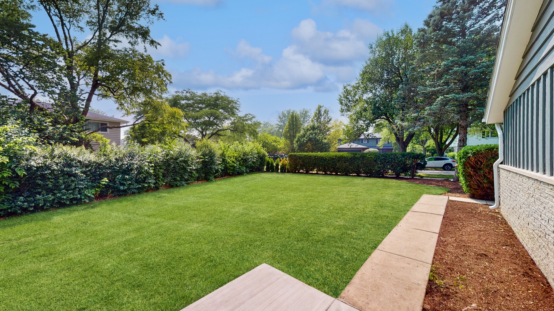1617 Birch Road Northbrook, IL 60062 - Photo 28 of 32 a view of a backyard with potted plants and large trees