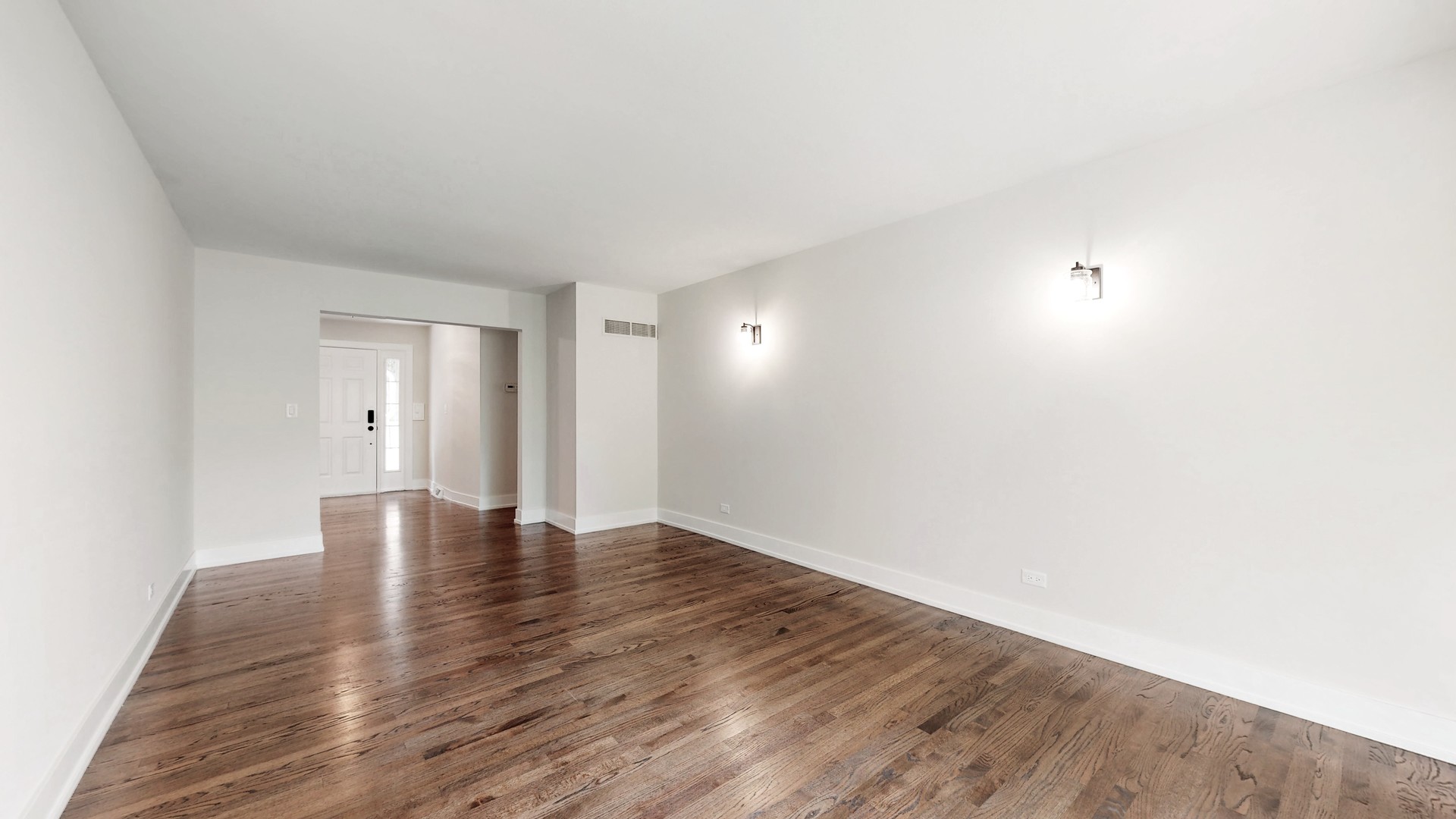 1617 Birch Road Northbrook, IL 60062 - Photo 5 of 32 a view of an empty room with wooden floor and a window