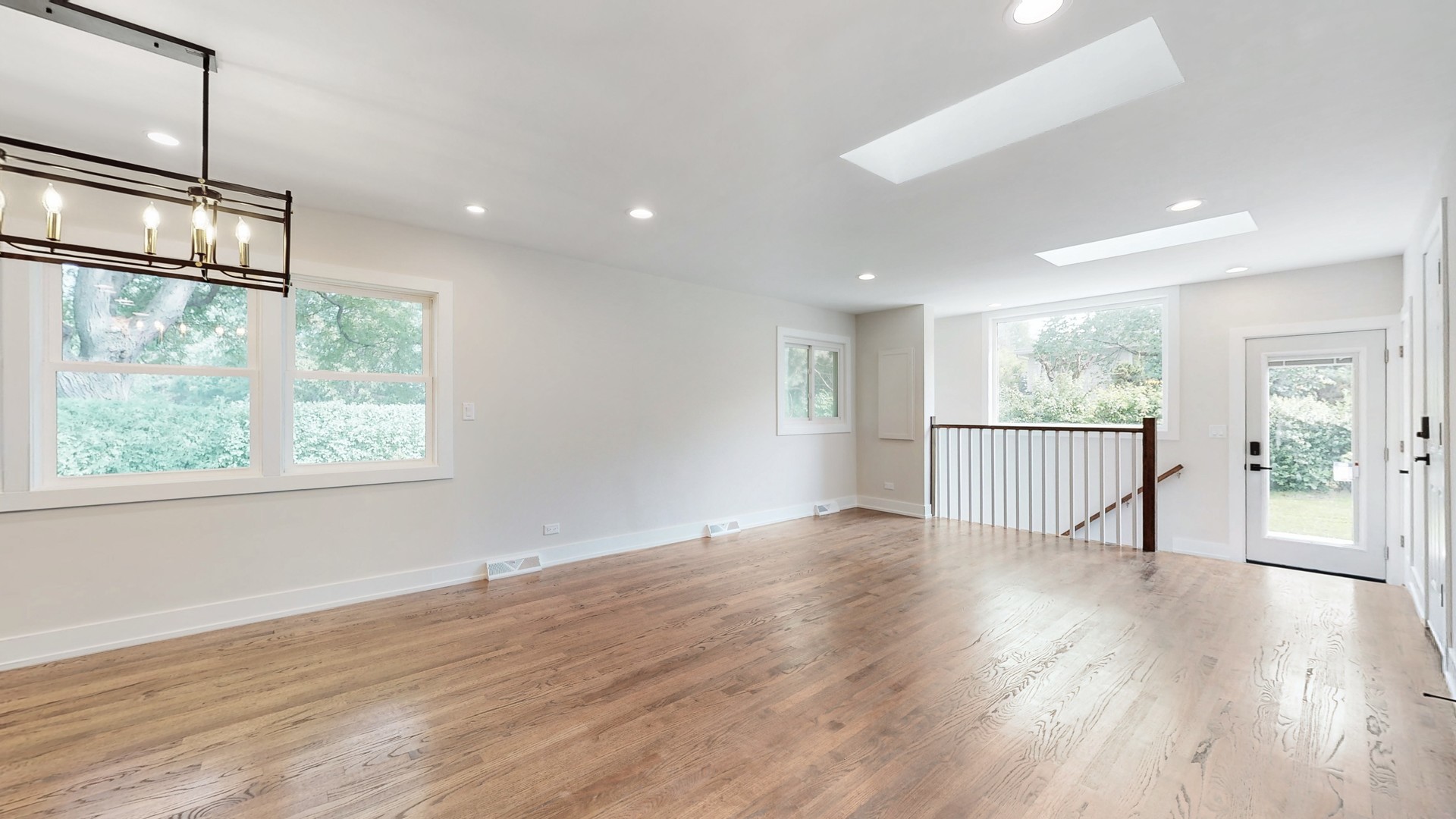 1617 Birch Road Northbrook, IL 60062 - Photo 8 of 32 a view of an empty room with wooden floor and a window