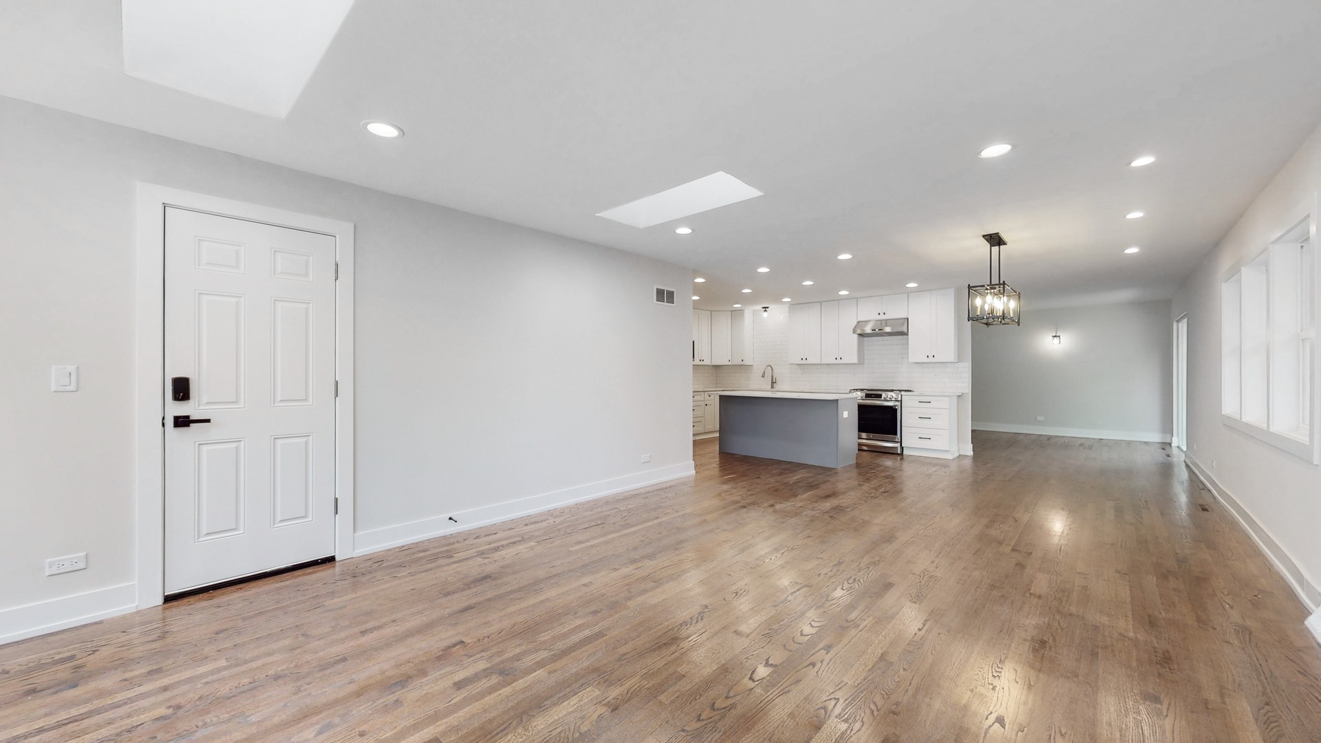 1617 Birch Road Northbrook, IL 60062 - Photo 10 of 32 a view of kitchen with kitchen island wooden floor and center island