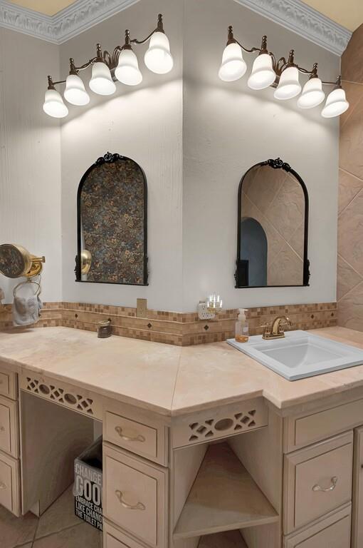 2300 North Rock Creek Road Waco, TX 76708 - Photo 14 of 40 a bathroom with a sink and a mirror