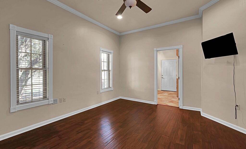 2300 North Rock Creek Road Waco, TX 76708 - Photo 19 of 40 a view of empty room with wooden floor and fan