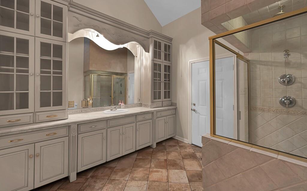 2300 North Rock Creek Road Waco, TX 76708 - Photo 20 of 40 a bathroom with a double vanity sink mirror and shower