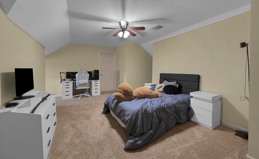 2300 North Rock Creek Road Waco, TX 76708 - Photo 24 of 40 a bedroom with a bed and a flat screen tv