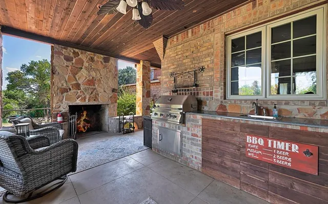 a view of a backyard with a small cabin and wooden fence