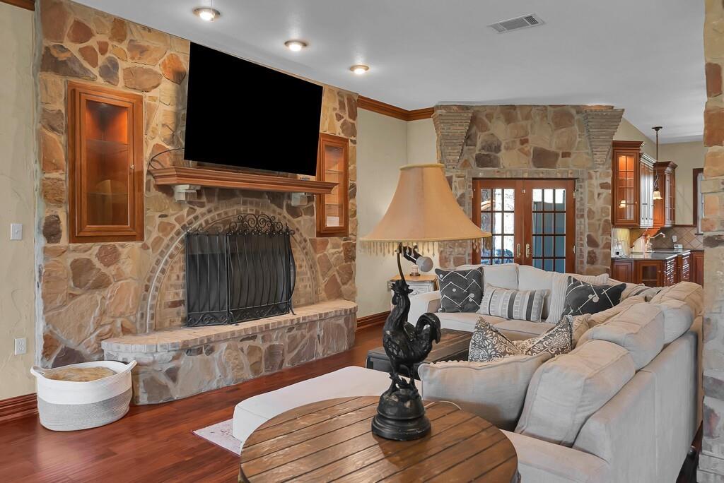 2300 North Rock Creek Road Waco, TX 76708 - Photo 6 of 40 a living room with furniture and a fireplace or television