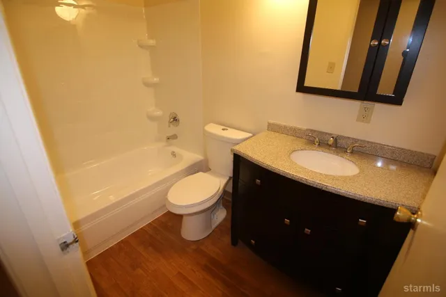 a kitchen with a sink a stove and a refrigerator