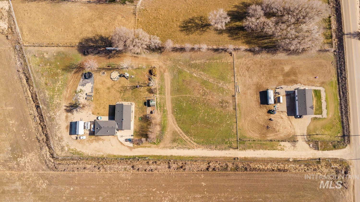 Aerial view of property and surrounding area with rural landscape
