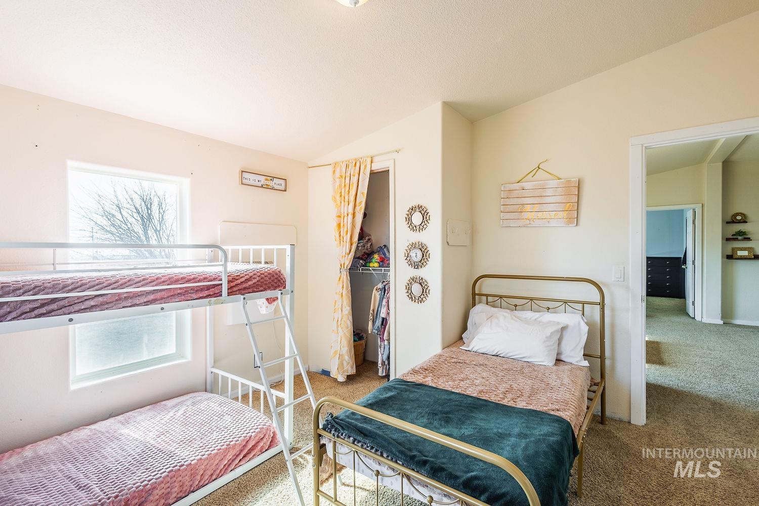21568 Market Road Parma, ID 83660 - Photo 12 of 22 Carpeted bedroom featuring lofted ceiling