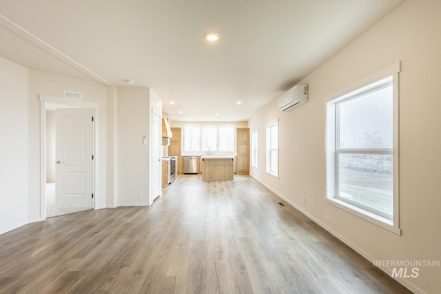 21568 Market Road Parma, ID 83660 - Photo 16 of 22 Unfurnished living room featuring light wood-style floors and recessed lighting