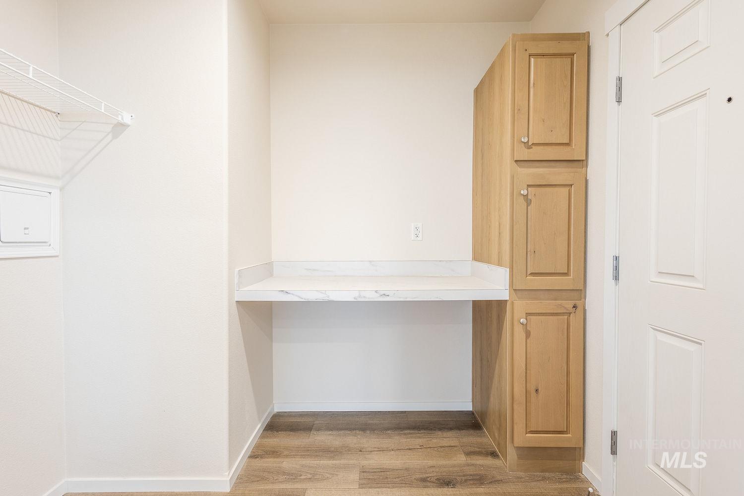 21568 Market Road Parma, ID 83660 - Photo 20 of 22 Unfurnished office with built in study area and light wood-style floors