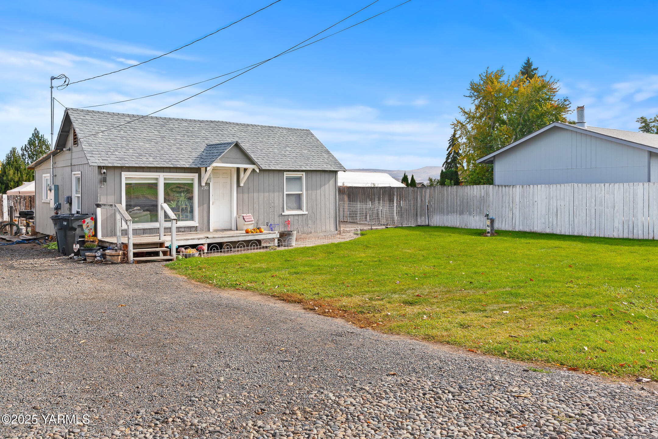 2301 North Wenas Road Selah, WA 98942 - Photo 1 of 25 a view of a house with a swimming pool and a yard