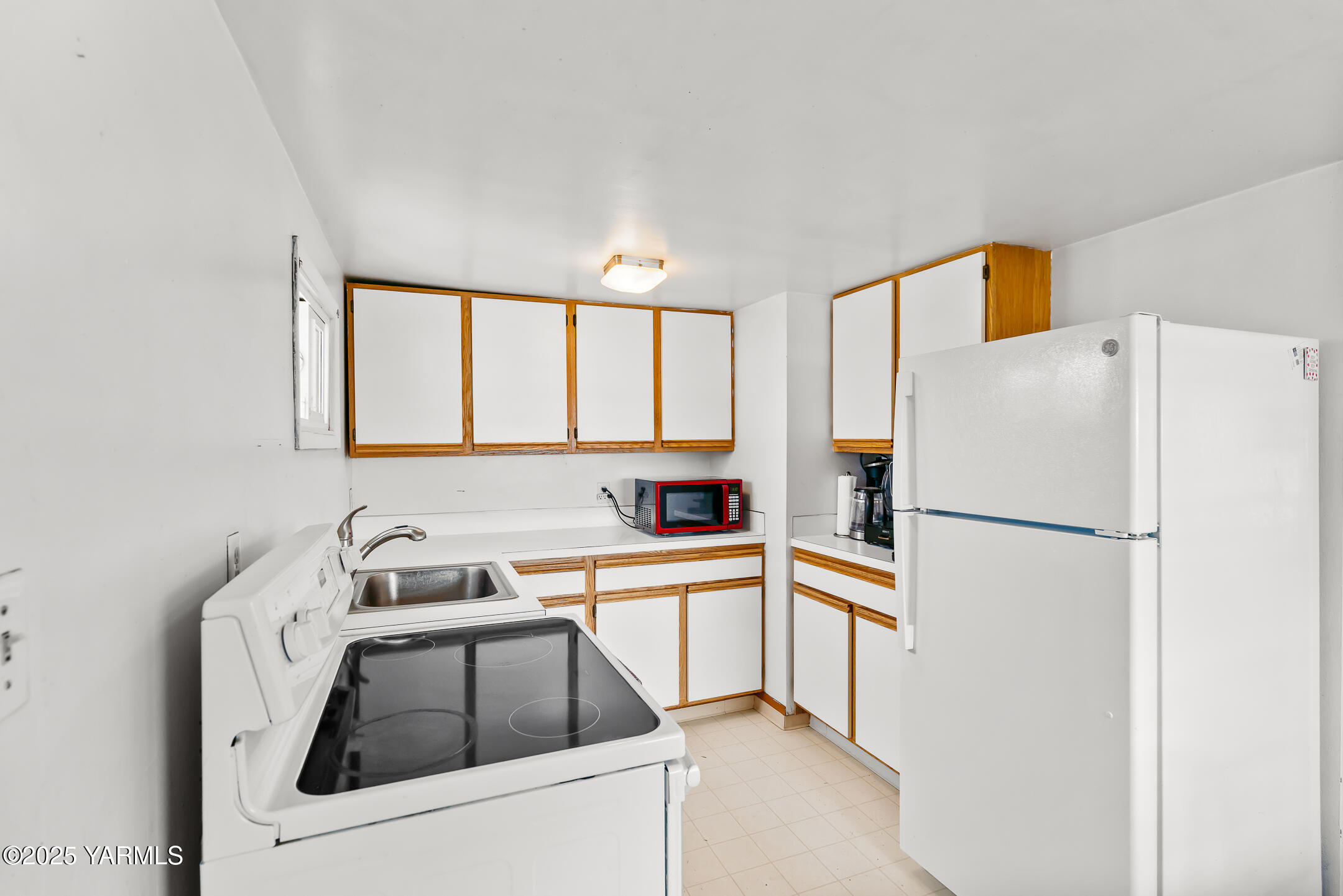 2301 North Wenas Road Selah, WA 98942 - Photo 10 of 25 a white refrigerator freezer sitting inside of a kitchen