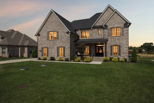 a front view of a house with a yard