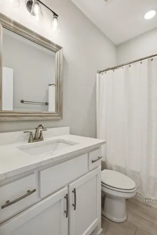 a kitchen with stainless steel appliances granite countertop a refrigerator a stove a sink and a microwave