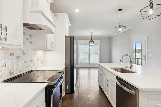 a bathroom with a toilet and shower curtain