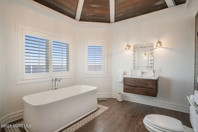 a bathroom with a sink a toilet and bathtub