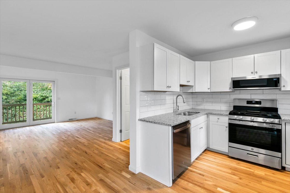 204 New Haven Avenue, Unit 2G Derby, CT 06418 - Photo 12 of 24 a kitchen with stainless steel appliances granite countertop a stove and a sink