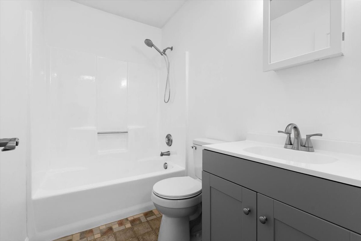 204 New Haven Avenue, Unit 2G Derby, CT 06418 - Photo 15 of 24 a bathroom with a sink a toilet and shower