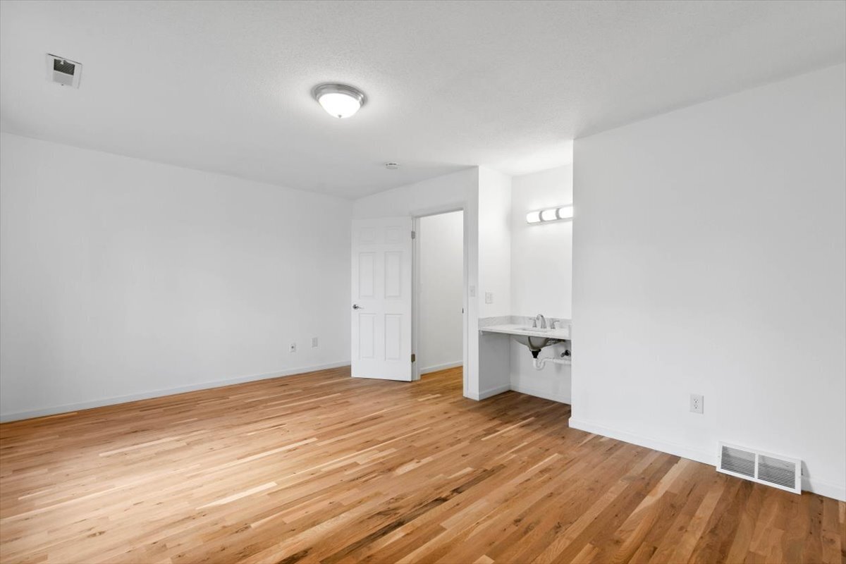 204 New Haven Avenue, Unit 2G Derby, CT 06418 - Photo 18 of 24 wooden floor in an empty room