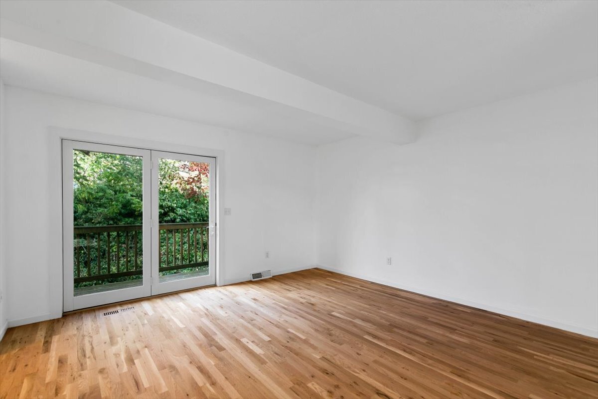 204 New Haven Avenue, Unit 2G Derby, CT 06418 - Photo 3 of 24 a view of empty room with wooden floor and fan