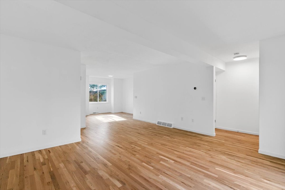 204 New Haven Avenue, Unit 2G Derby, CT 06418 - Photo 5 of 24 wooden floor in an empty room
