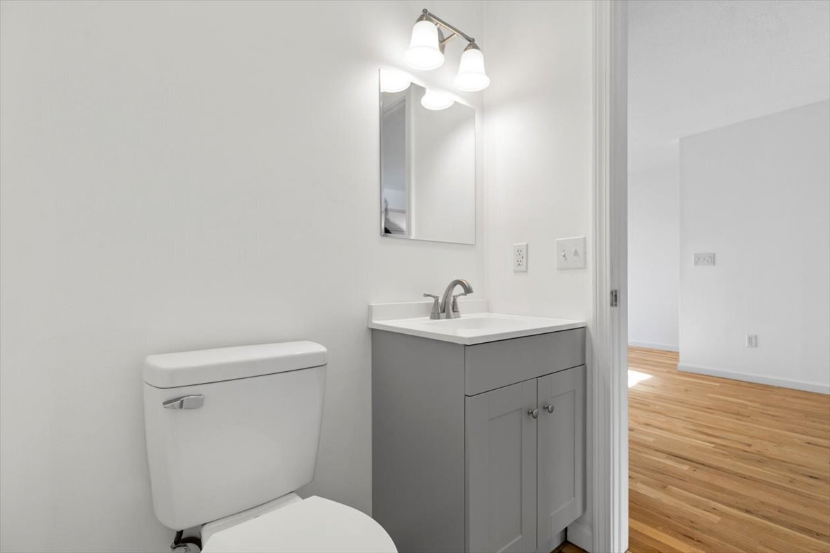 204 New Haven Avenue, Unit 2G Derby, CT 06418 - Photo 8 of 24 a bathroom with a toilet a sink and mirror