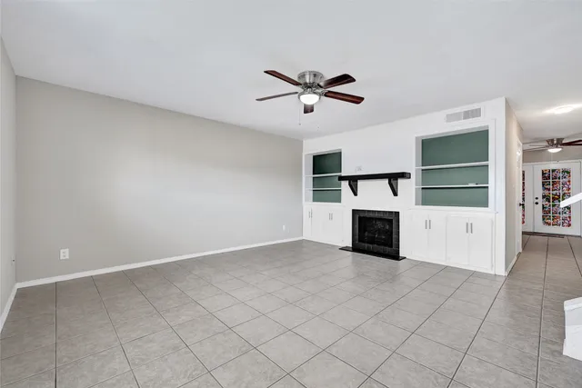 a view of a kitchen with furniture and a ceiling fan