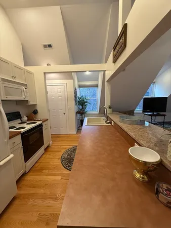 a view of a livingroom with furniture and garage