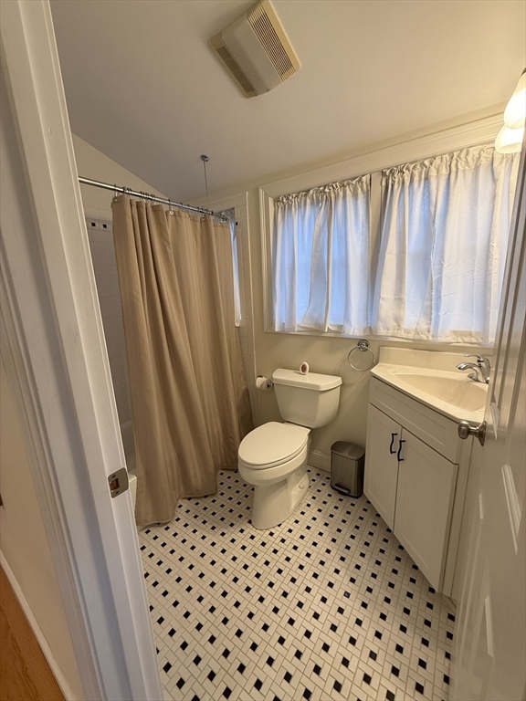 79 Freeman Road, Unit ADU Charlton, MA 01507 - Photo 13 of 18 a bathroom with a sink a toilet a mirror and shower