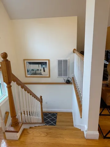 a view of a hallway with staircase