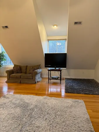 a living room with couch and a coffee table