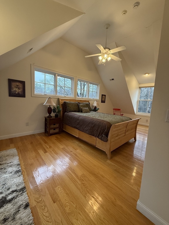 79 Freeman Road, Unit ADU Charlton, MA 01507 - Photo 7 of 18 a living room with a bed furniture chandelier and a window