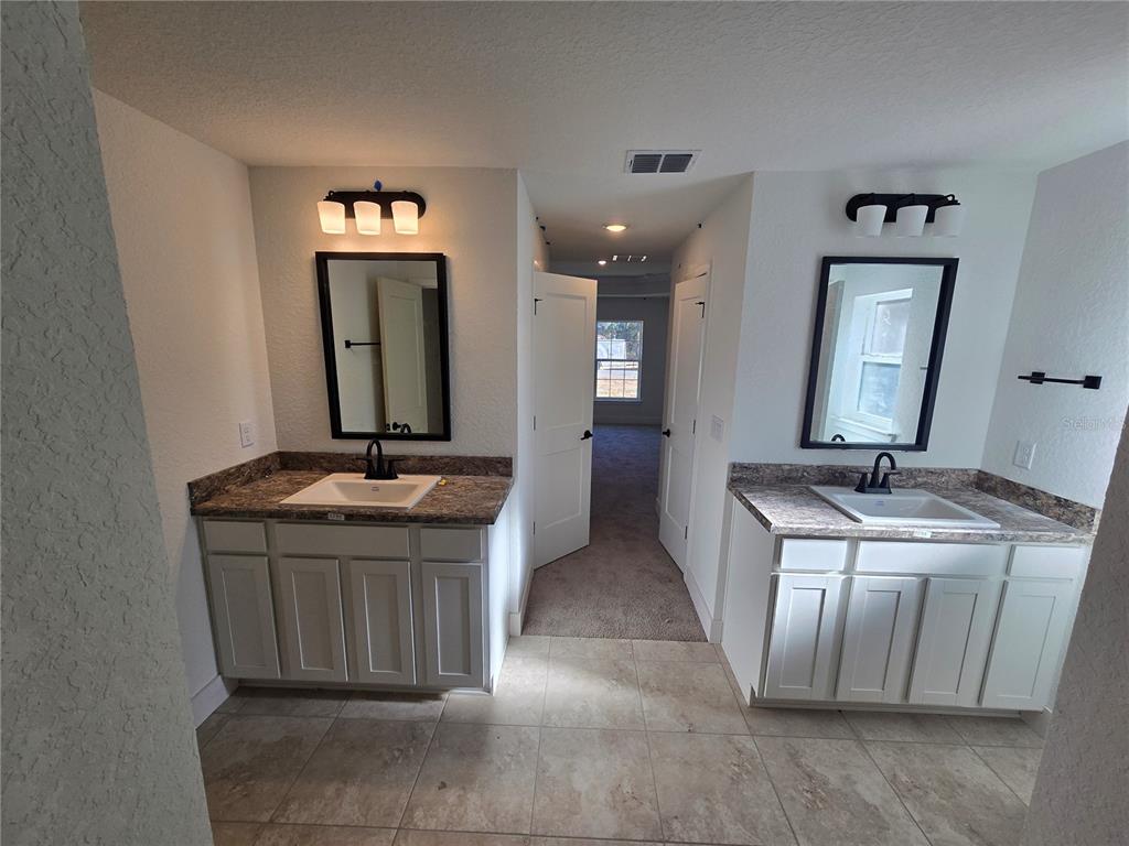 2533 Clearwood Street Inverness, FL 34452 - Photo 18 of 21 a room with a sink and a mirror