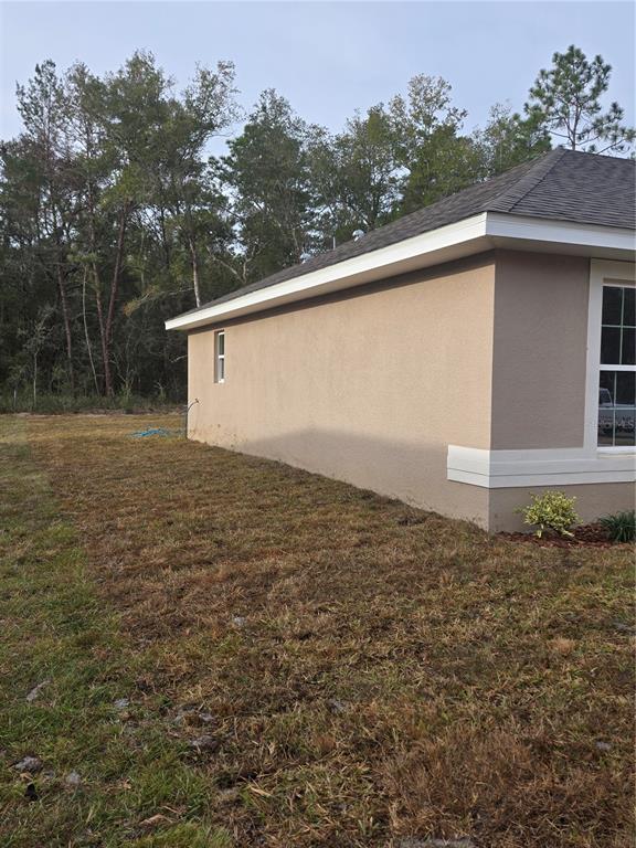 2533 Clearwood Street Inverness, FL 34452 - Photo 2 of 21 a backyard of a house with lots of green space