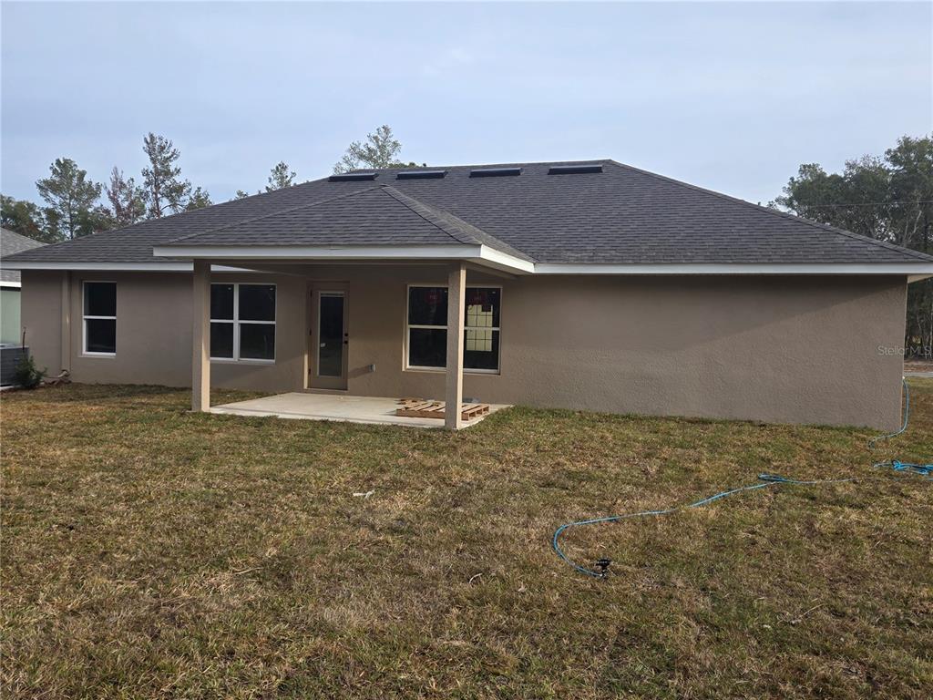 2533 Clearwood Street Inverness, FL 34452 - Photo 3 of 21 a house with trees in the background