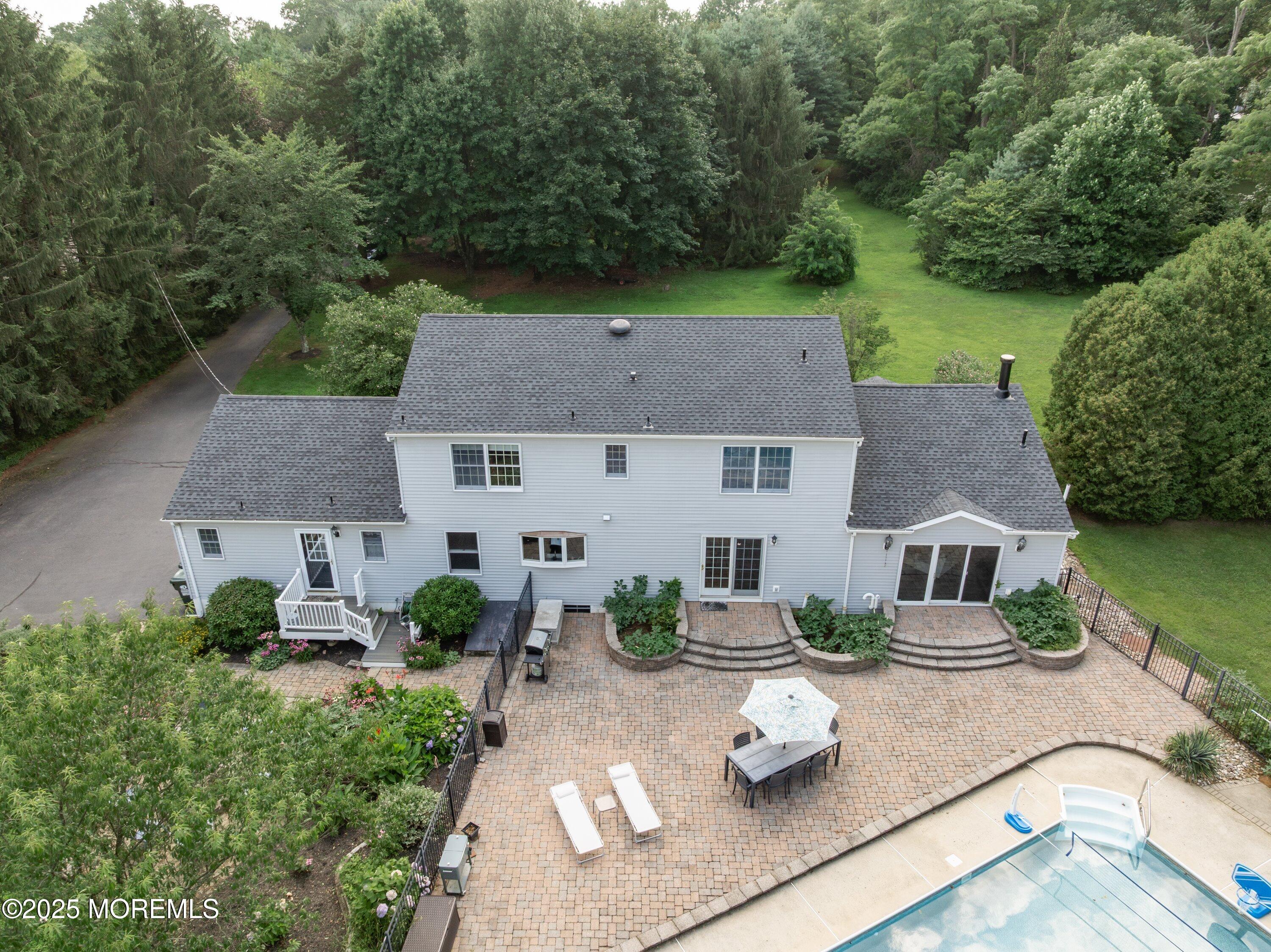 75 Yellow Meetinghouse Road Cream Ridge, NJ 08514 - Photo 54 of 63 an aerial view of a house with swimming pool and garden