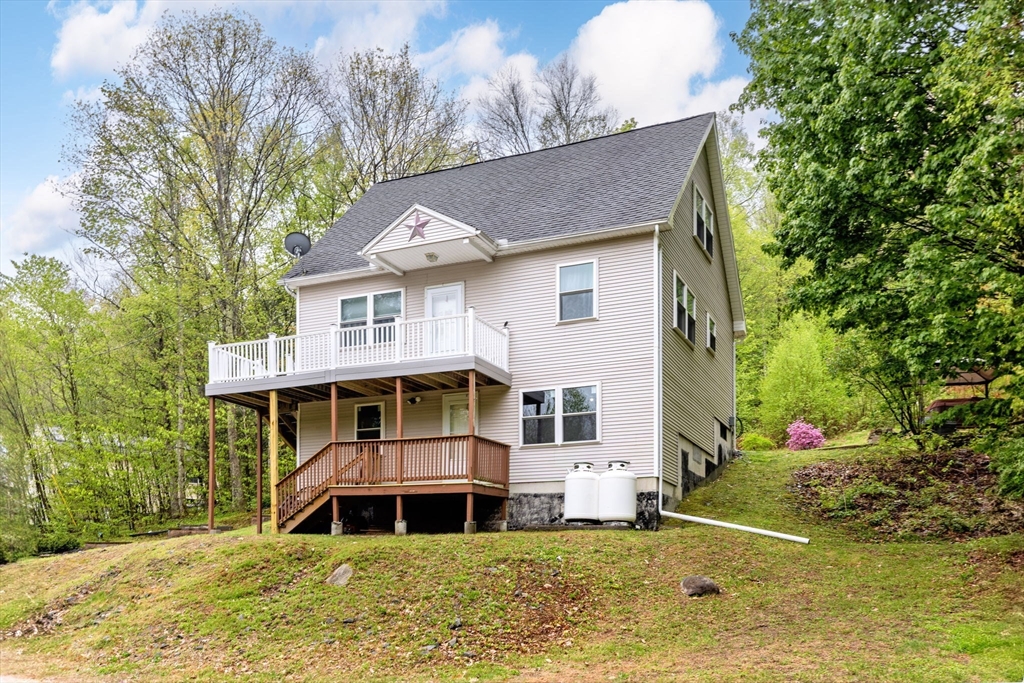 302 Middlefield Road Chester, MA 01011 - Photo 34 of 42 a front view of a house with a yard