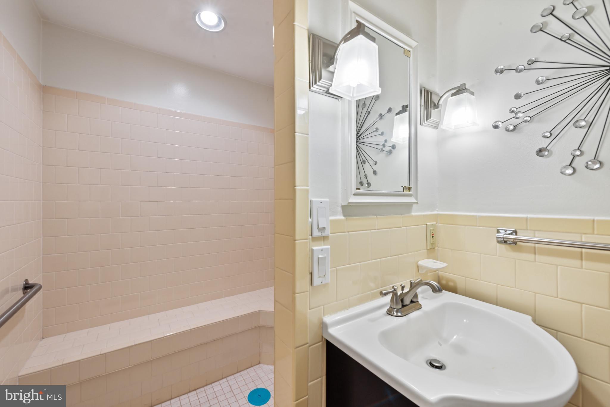 1309 Midmeadow Road Baltimore, MD 21286 - Photo 29 of 37 a bathroom with a sink a toilet and shower