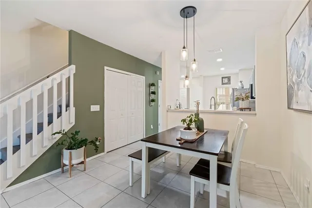 a dining room with furniture and window