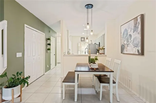a dining room with furniture and window
