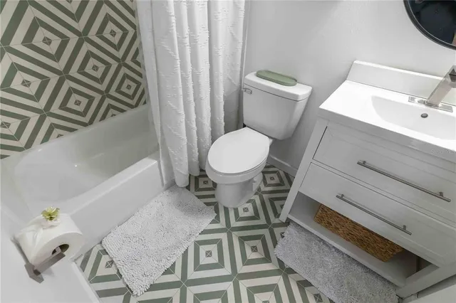 a bathroom with a toilet and a sink