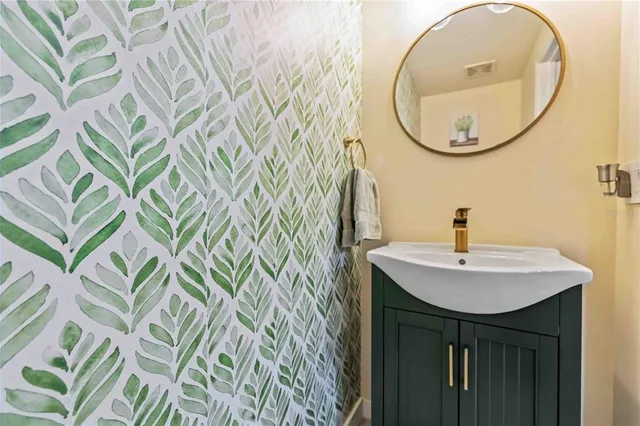 a bathroom with a sink and a mirror