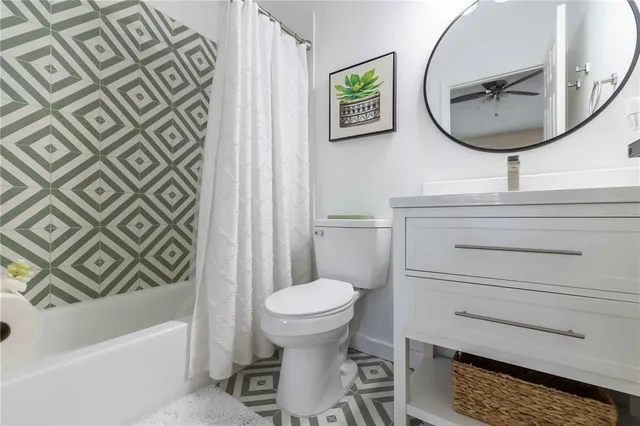 a bathroom with a toilet a sink and bathtub