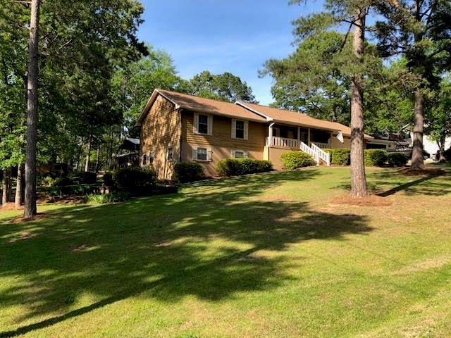105 David Coley Road Macon, GA 31216 - Photo 1 of 6 a front view of a house with garden